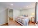 This bedroom features a neutral color scheme, comfortable bed, and ample natural light at 14833 Vine St, Thornton, CO 80602