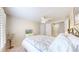 Well-lit bedroom with ceiling fan, natural lighting and ensuite bath provides a private retreat at 14833 Vine St, Thornton, CO 80602