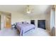 Vaulted ceilings and neutral paint colors are the backdrop for the bedroom's furniture and decor at 14833 Vine St, Thornton, CO 80602