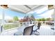 Relaxing covered deck with comfortable seating, perfect for enjoying the peaceful neighborhood views at 14833 Vine St, Thornton, CO 80602