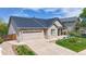 Inviting single-Gathering home features a two-car garage, manicured lawn, and charming front porch in a desirable neighborhood at 14833 Vine St, Thornton, CO 80602