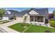 Charming single-Gathering home boasts a well-manicured lawn, a two-car garage and a welcoming front porch at 14833 Vine St, Thornton, CO 80602