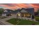 Charming single-Gathering home boasts a well-manicured lawn, a two-car garage and a welcoming front porch at 14833 Vine St, Thornton, CO 80602