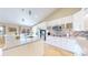 This eat-in kitchen offers granite countertops, modern appliances, and an island for seating and food preparation at 14833 Vine St, Thornton, CO 80602