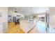 Open layout kitchen with a large island, granite countertops, stainless steel appliances, and seamless flow to the living spaces at 14833 Vine St, Thornton, CO 80602