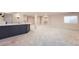 Large basement space featuring plush carpet and a stylish bar area for relaxation at 22019 E Arbor Dr, Aurora, CO 80016