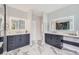 Lavish bathroom featuring dual vanities, marble floors, and modern lighting at 22019 E Arbor Dr, Aurora, CO 80016