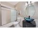 Chic bathroom featuring modern vanity with unique vessel sink and a shower-tub combination at 22019 E Arbor Dr, Aurora, CO 80016