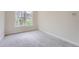 Bright bedroom with large window and neutral carpet provides a serene and inviting space at 22019 E Arbor Dr, Aurora, CO 80016