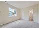 Bright bedroom with neutral carpet and a window offers a serene space at 22019 E Arbor Dr, Aurora, CO 80016