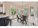 Cozy breakfast nook with large windows, French doors and a charming round table at 22019 E Arbor Dr, Aurora, CO 80016
