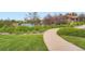 Inviting community pool area with lush landscaping, providing a refreshing and relaxing recreational space at 22019 E Arbor Dr, Aurora, CO 80016
