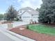 Charming two-story home featuring a three-car garage and well-manicured landscaping at 22019 E Arbor Dr, Aurora, CO 80016