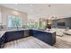 Open-concept kitchen with granite countertops, stainless steel appliances, and adjacent living area at 22019 E Arbor Dr, Aurora, CO 80016