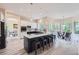 Modern kitchen featuring a large island, stainless appliances, and a casual dining area at 22019 E Arbor Dr, Aurora, CO 80016