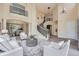 Bright living room boasts soaring ceilings, a curved staircase, and stylish decor and furnishings at 22019 E Arbor Dr, Aurora, CO 80016