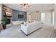 Inviting living room features a stone fireplace, modern lighting, and comfortable seating at 22019 E Arbor Dr, Aurora, CO 80016