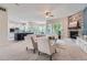 Inviting living room with fireplace, neutral tones, open concept to the kitchen at 22019 E Arbor Dr, Aurora, CO 80016