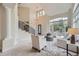 Inviting living room with high ceilings, large window, and cozy seating with an open floorplan at 22019 E Arbor Dr, Aurora, CO 80016