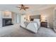 Beautiful main bedroom featuring a fireplace, ceiling fan, and soft, neutral decor at 22019 E Arbor Dr, Aurora, CO 80016