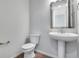 Powder room features a pedestal sink and modern fixtures at 9972 Wheeling St, Commerce City, CO 80022