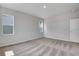 Carpeted bedroom with multiple windows providing natural light at 9972 Wheeling St, Commerce City, CO 80022