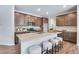 Spacious kitchen with a quartz island, modern appliances, and breakfast bar seating at 9972 Wheeling St, Commerce City, CO 80022