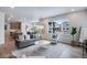 Bright and airy living room featuring modern decor, a large window, and an open floor plan at 9972 Wheeling St, Commerce City, CO 80022