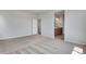 Main bedroom with adjoining bathroom and neutral carpeting at 9972 Wheeling St, Commerce City, CO 80022