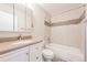 Updated bathroom featuring a vanity with modern fixtures, a large mirror, and a tiled shower-tub combination at 9005 E Lehigh Ave # 16, Denver, CO 80237