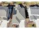 Aerial view of the home with solar panels installed on the roof at 802 Eva Peak Dr, Erie, CO 80516