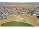 An aerial view of the neighborhood with a green park with playground near the residence at 802 Eva Peak Dr, Erie, CO 80516