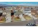 Aerial view of the homes in the neighborhood, some with solar panels on the roof at 802 Eva Peak Dr, Erie, CO 80516