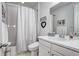 Bright bathroom features a shower-tub combo, vanity with sink, and decorative accents at 802 Eva Peak Dr, Erie, CO 80516