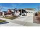 Charming home with a covered front porch and well-maintained landscaping at 802 Eva Peak Dr, Erie, CO 80516