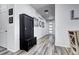 Inviting hallway with stylish flooring and a convenient storage cabinet at 802 Eva Peak Dr, Erie, CO 80516