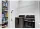 Well-organized laundry room with modern washer and dryer at 802 Eva Peak Dr, Erie, CO 80516