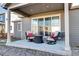 Outdoor patio features a seating area and a sliding door leading to the house at 802 Eva Peak Dr, Erie, CO 80516