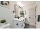 Bright bathroom with white cabinets, vanity, large mirror and modern fixtures at 5721 W 92Nd Ave # 96, Westminster, CO 80031