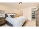 Nicely decorated bedroom featuring a queen bed, dresser, and overhead lighting at 5721 W 92Nd Ave # 96, Westminster, CO 80031