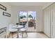 Bright breakfast nook with table and two chairs by sliding glass door to a deck at 5721 W 92Nd Ave # 96, Westminster, CO 80031