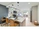 Modern kitchen features sleek cabinetry, quartz countertops, and a breakfast bar with seating at 5721 W 92Nd Ave # 96, Westminster, CO 80031