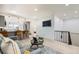 Bright and airy living room with an open-concept design, modern furnishings, and a staircase at 5721 W 92Nd Ave # 96, Westminster, CO 80031