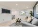 Spacious living room with a large window, comfortable seating, and modern decor accents at 5721 W 92Nd Ave # 96, Westminster, CO 80031