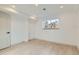 Bright, empty room with laminate floors, neutral paint, a window and recessed lighting at 5721 W 92Nd Ave # 96, Westminster, CO 80031