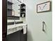 Stylish bathroom with a modern sink, decorative shelves, and soothing wall art at 21258 E Aberdeen Pl, Centennial, CO 80015