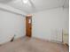 Simple bedroom featuring neutral carpet and a door, offering a blank canvas for customization and comfort at 21258 E Aberdeen Pl, Centennial, CO 80015