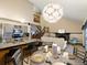 Open kitchen view featuring stainless steel appliances, granite counters, and a large island with seating at 21258 E Aberdeen Pl, Centennial, CO 80015