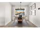 Light-filled dining area with a round table, chairs, and backyard view at 3088 S Grape Way, Denver, CO 80222