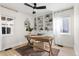 Home office with built-in shelving, desk, and ceiling fan at 3088 S Grape Way, Denver, CO 80222